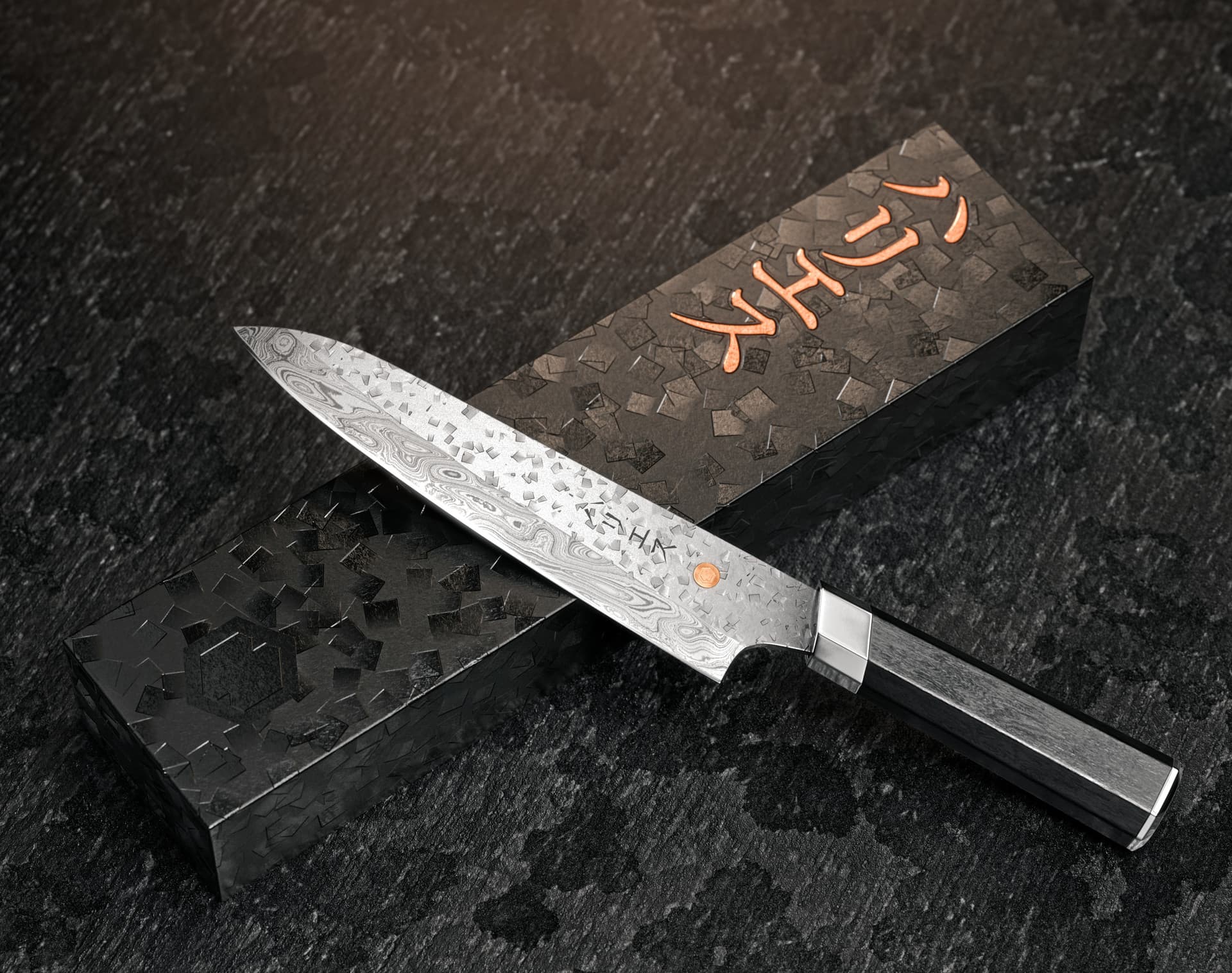 A Damascus steel chef's knife resting diagonally across its branded presentation box